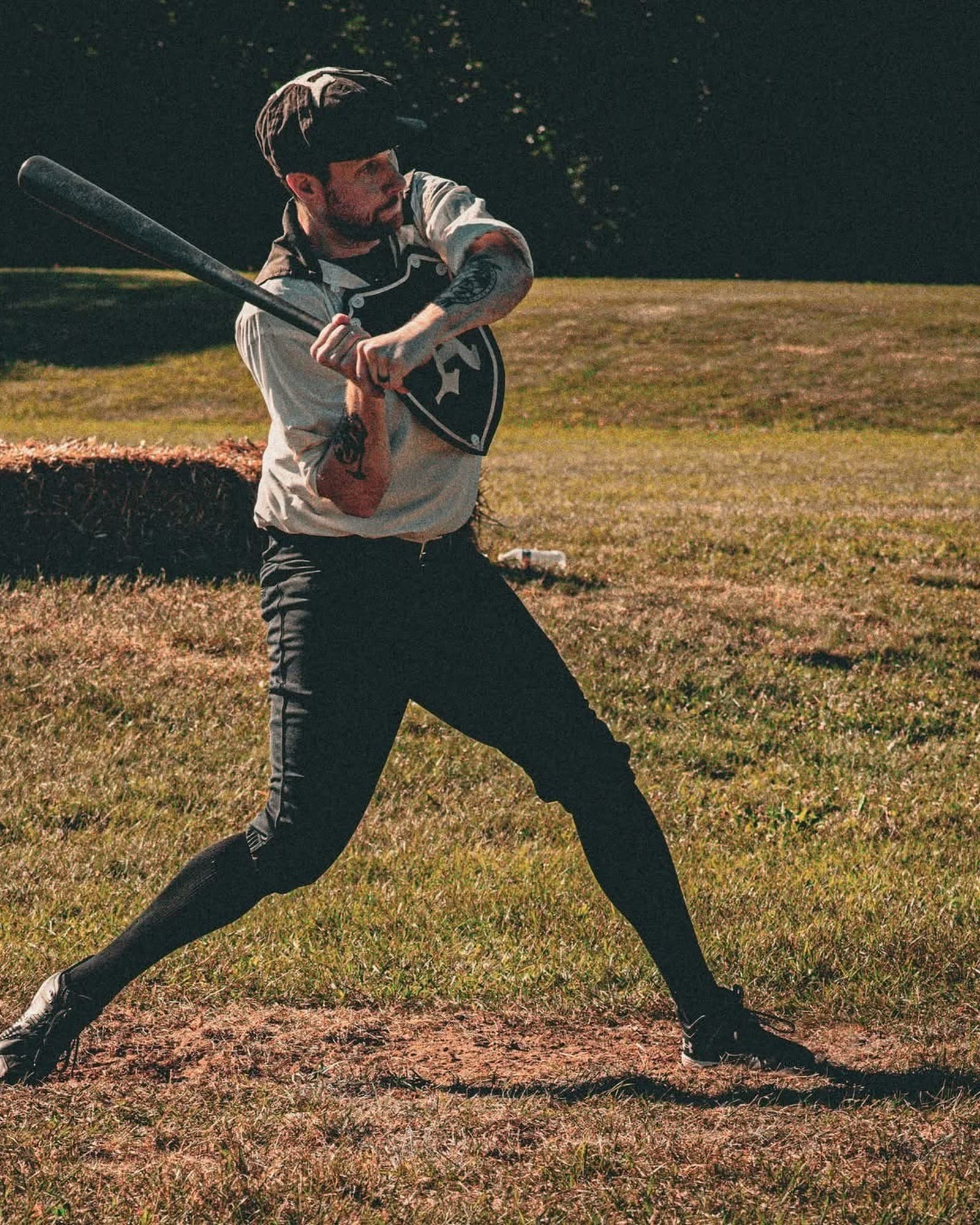 Eric mid-swing in a vintage base ball game