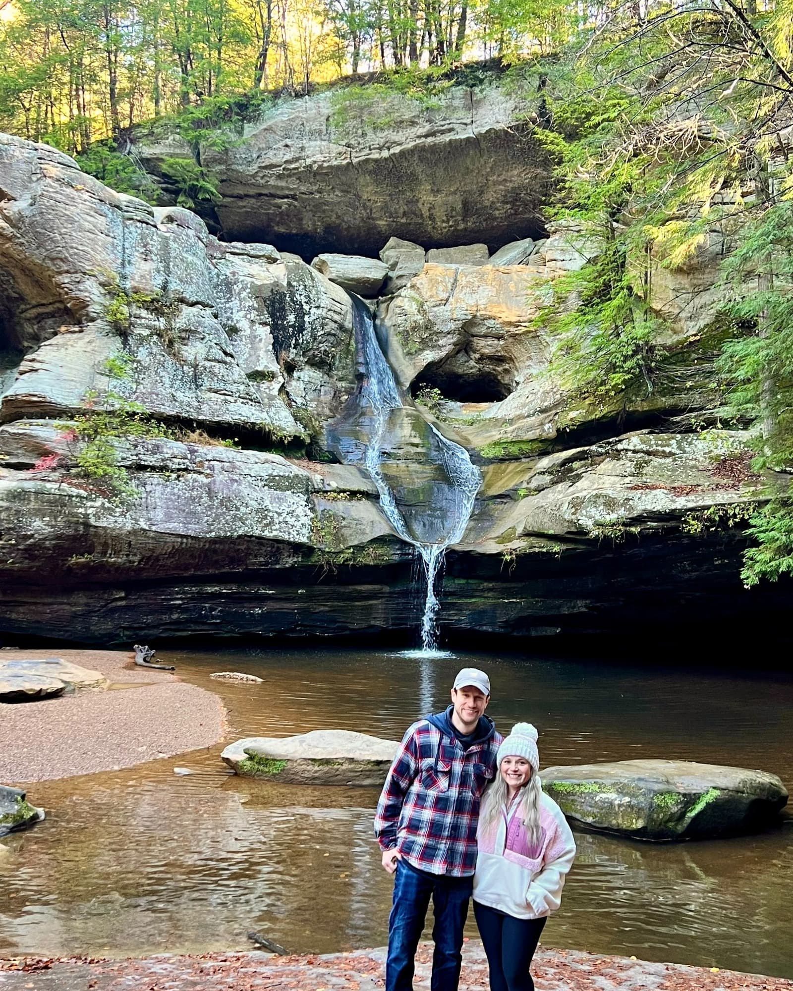 Eric and his partner at a waterfall